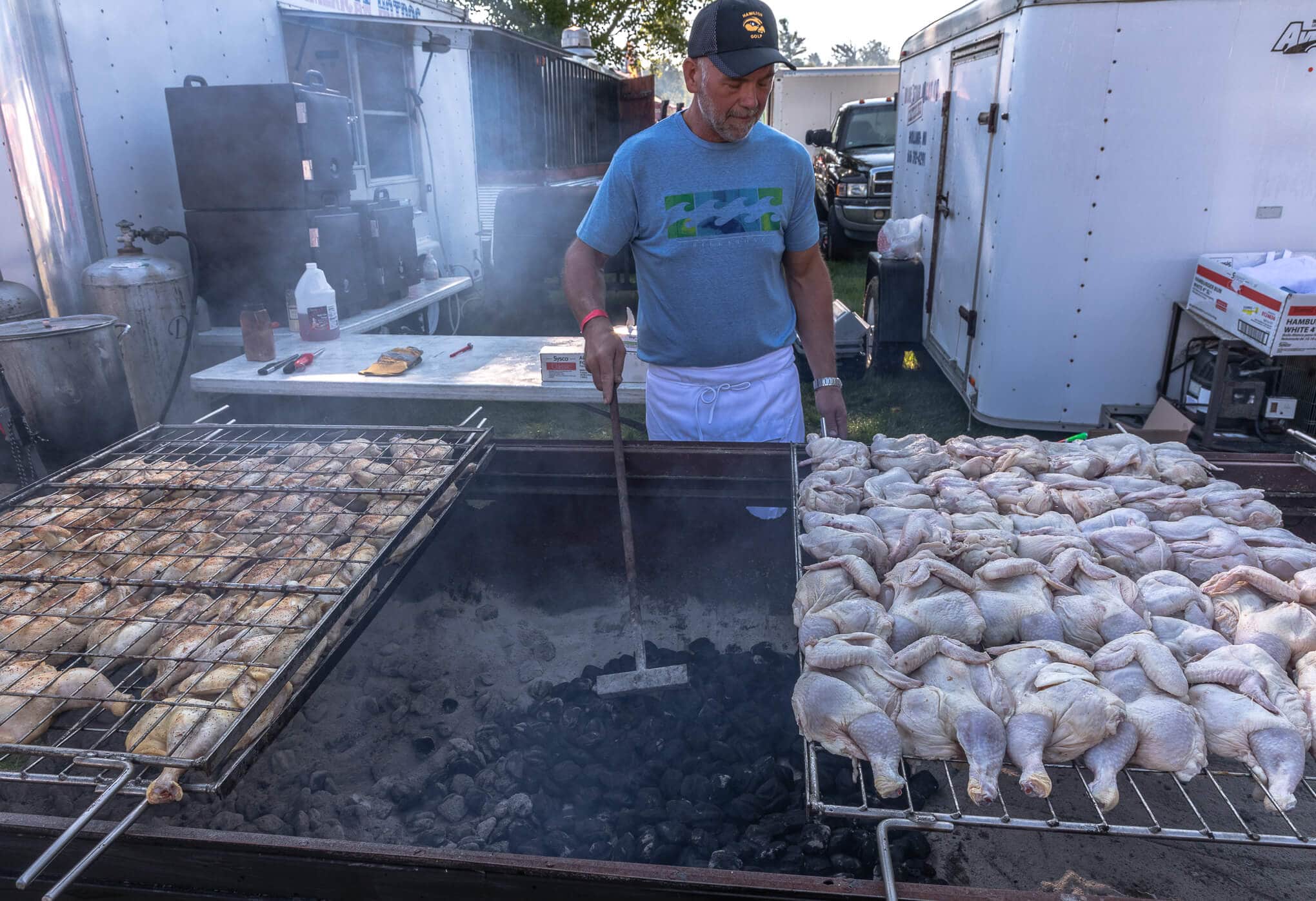 a man grilling chicken